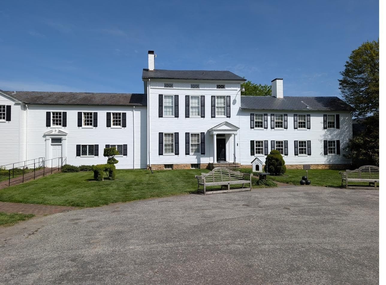The manor house at Ladew Topiary Gardens with its shuttered facade
