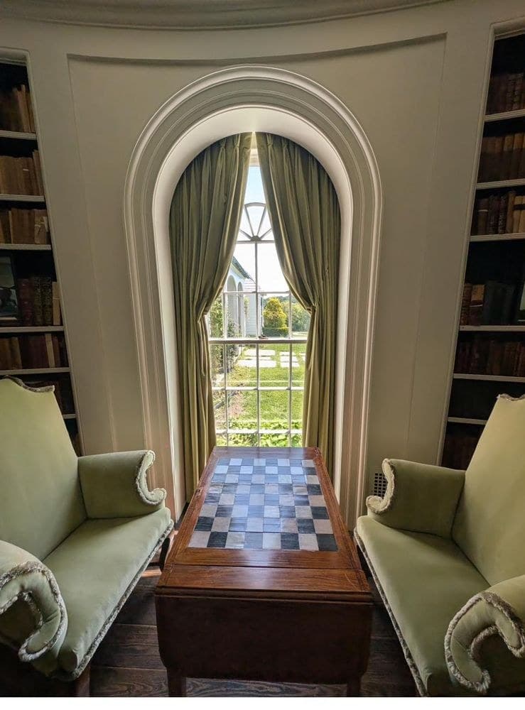 The library window seat beneath its arched Palladian light