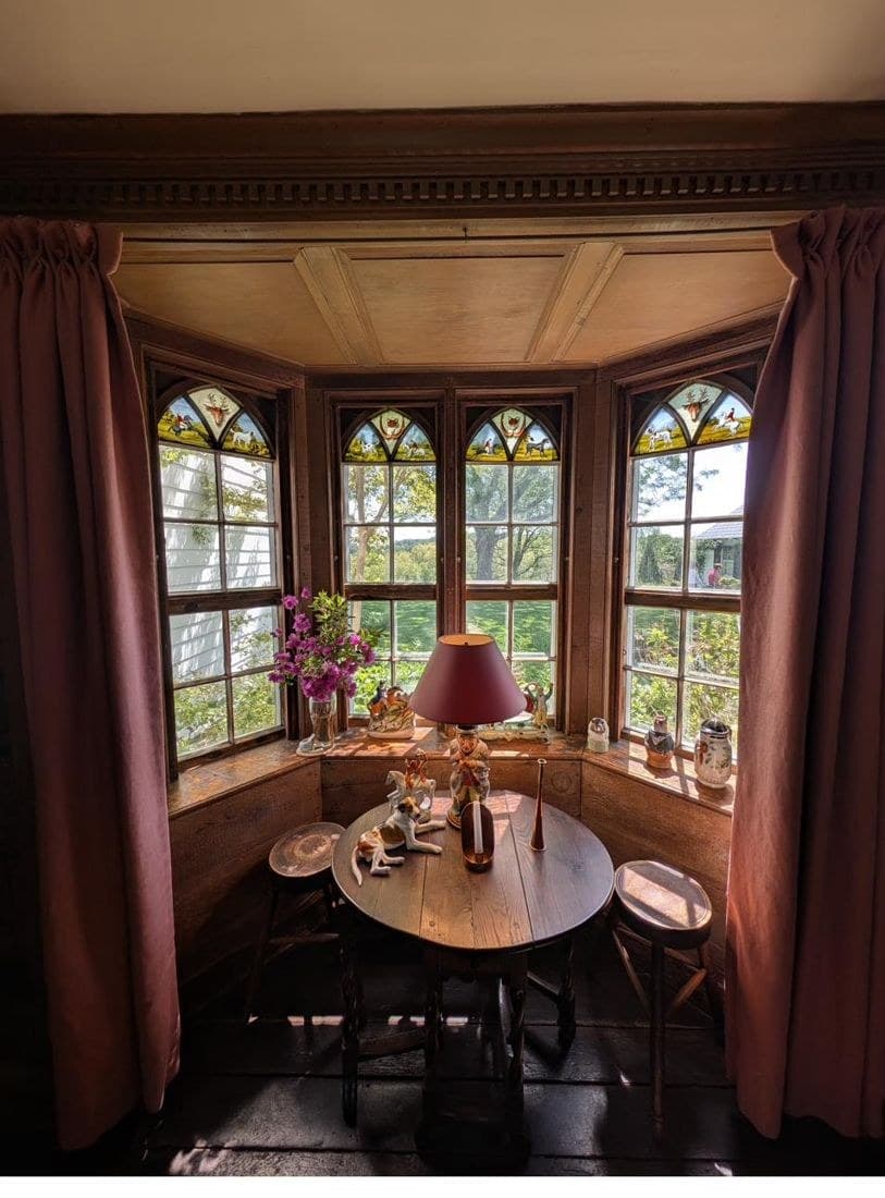 The study's Gothic bay with hand-painted glass in its upper lights