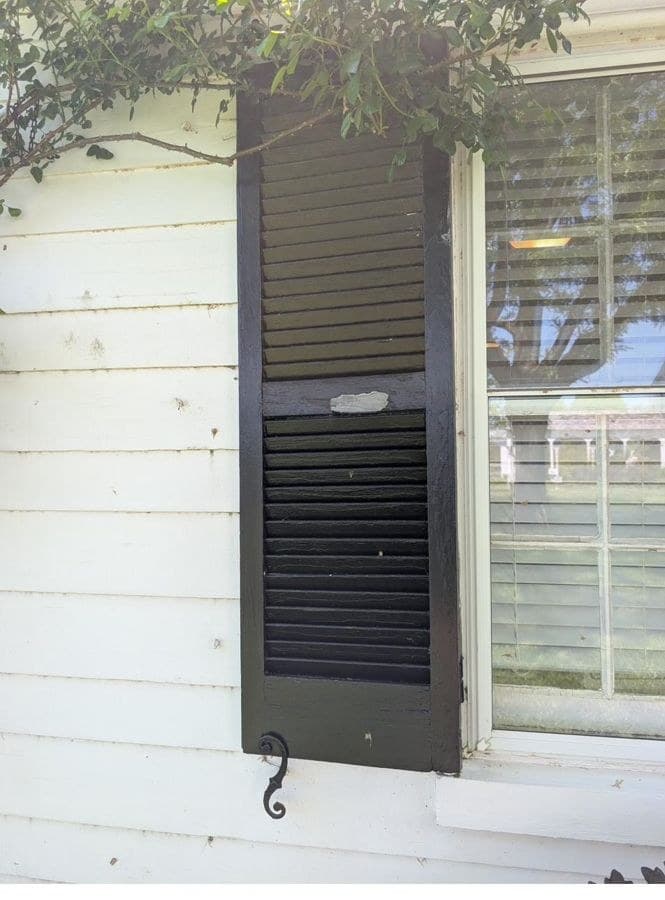The surviving circa 1929 exterior shutter with its original hardware