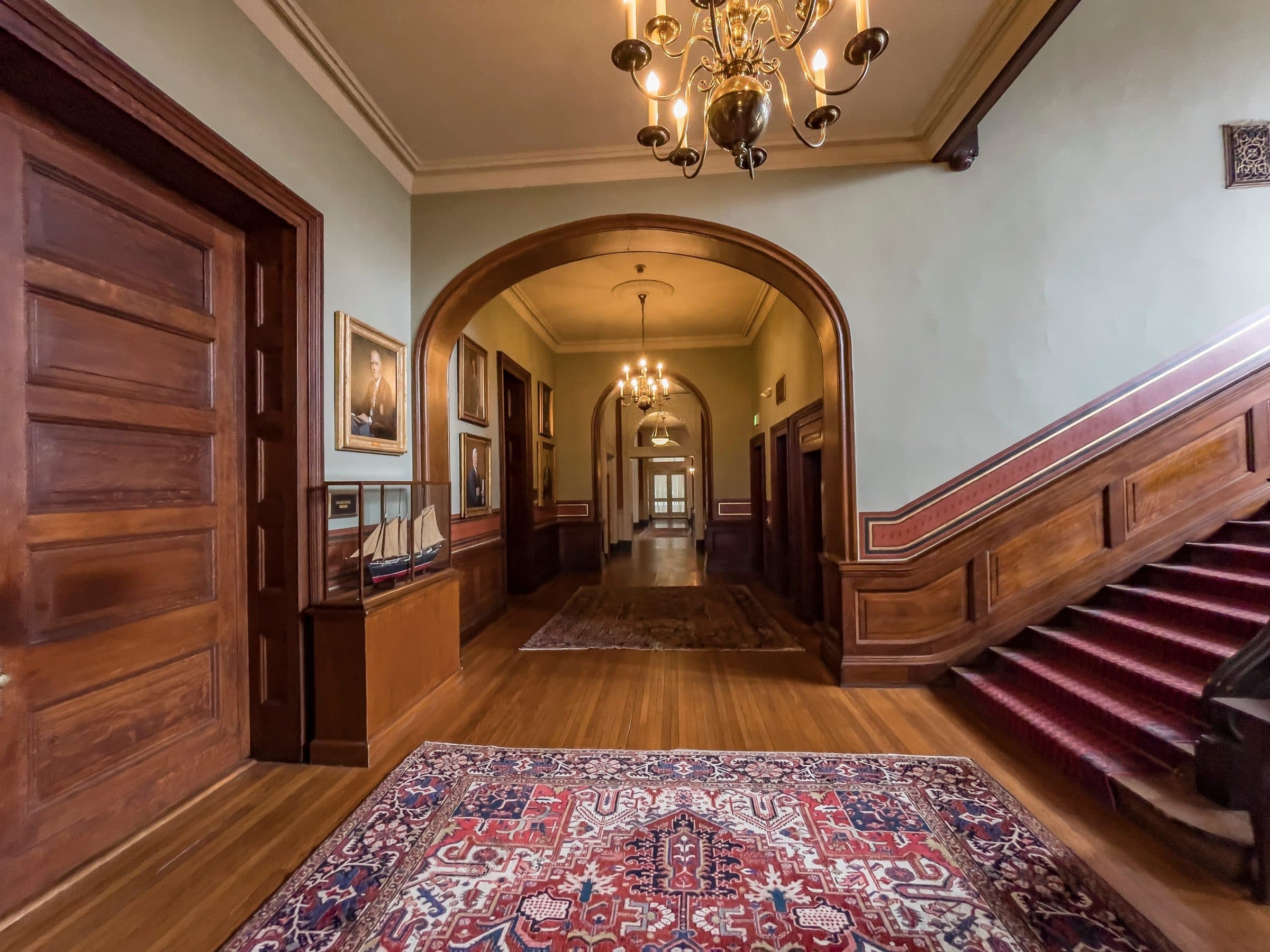 Paneled corridor leading to the principal stair