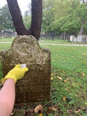 Conservation cleaning of an early headstone